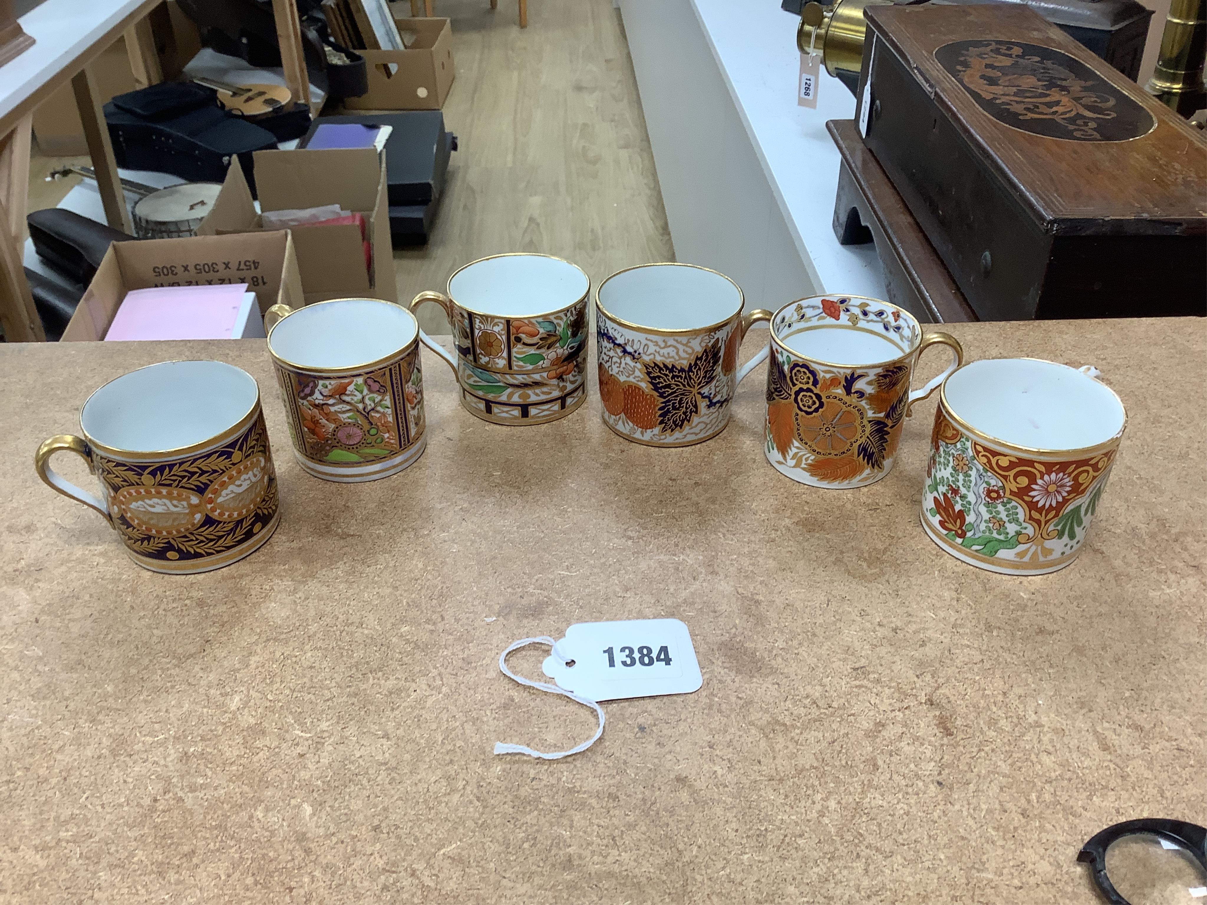 Twelve 1800-1820 English Imari style patterned coffee cans